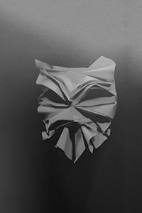 Een oranje masker ontworpen door Pentagram Design studio voor London Design Biennale in 2018.